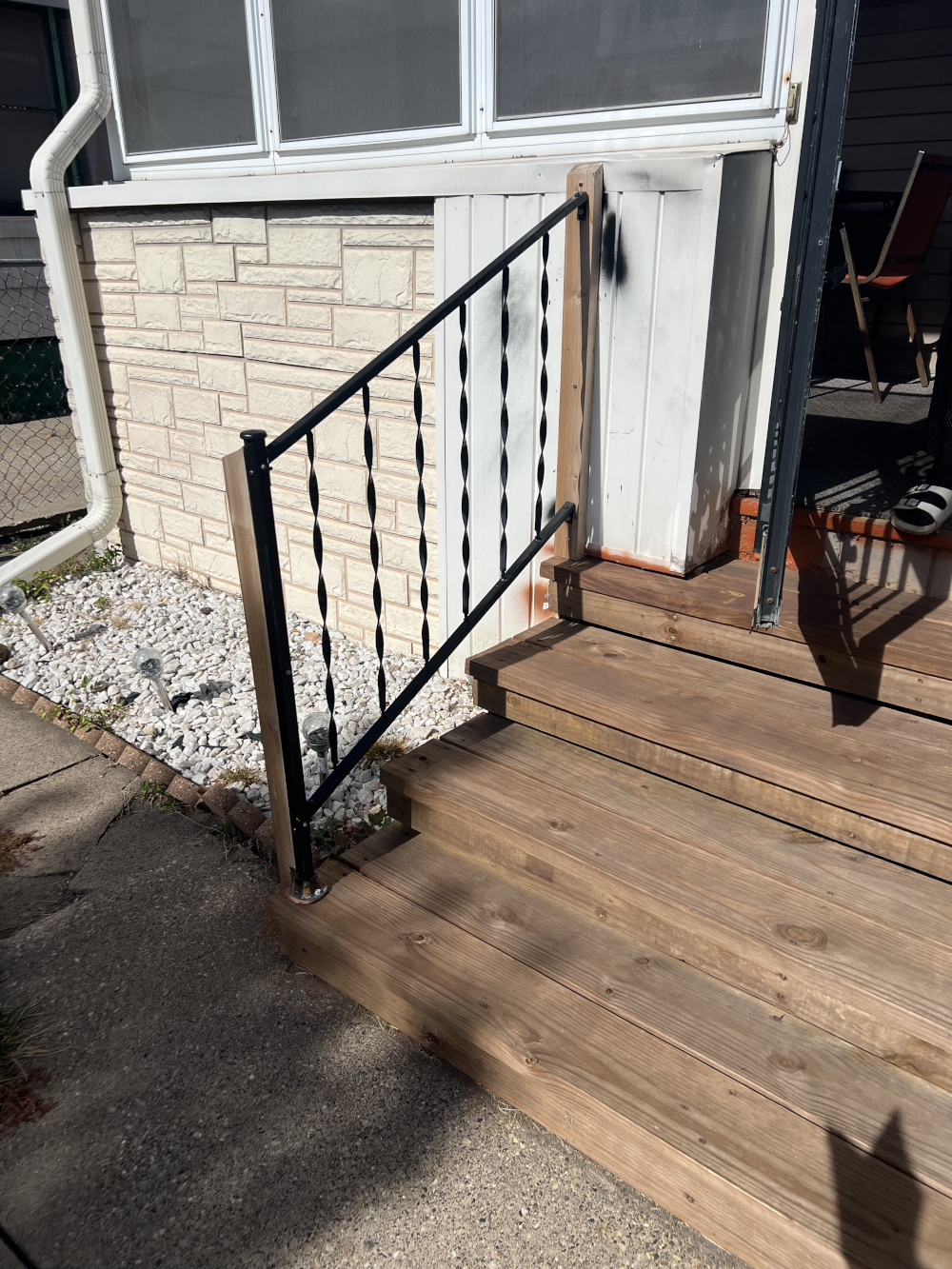 front railing along the steps of a house